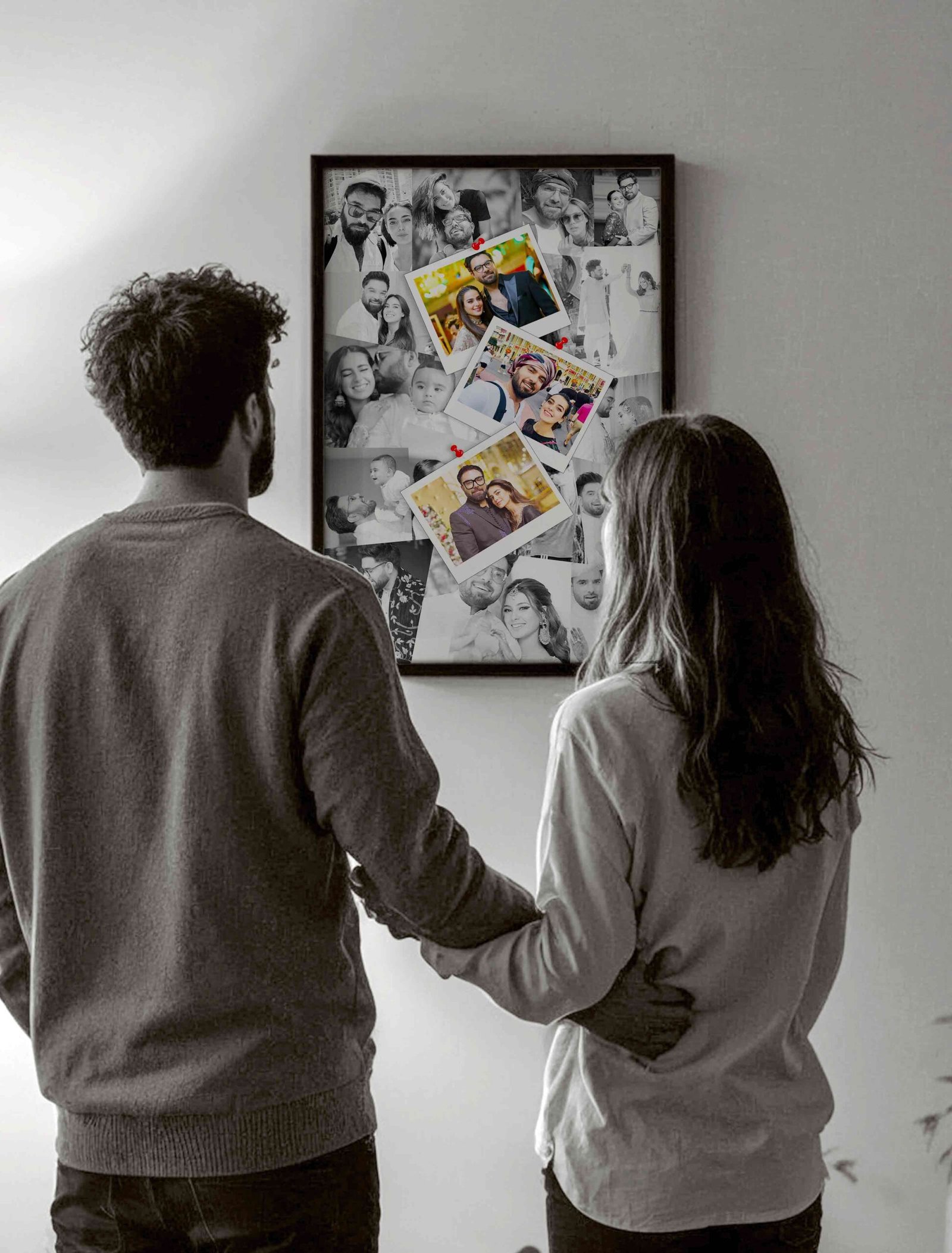 Couple standing in front of a memory picture frame