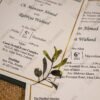 Dark green wedding envelope with gold metallic floral accent
