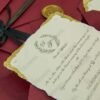 Burgundy envelope wedding invitation set with gold leaf cards spread