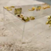 Clear acrylic Haq Mehar box with intricate gold corner patterns