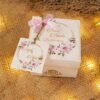 Open tray Baat Paaki bid boxes with pink floral tag