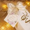 Floral Nikkah Mubarak tag close-up on bid boxes