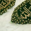 Close-up of gold Mashallah calligraphy on deep green velvet Imam Zamin with golden scalloped stone border