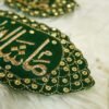 Green and gold Mashallah Nikkah armband pair on white background