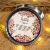 Close-up of interior Quranic verse and thank you note in tin box