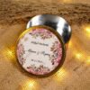 Top view of floral metallic tin bid boxes showing couple names