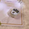 Luxurious white favor cards with pearl rhinestone tally counters