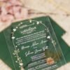 Green acrylic wedding invitation with Quranic calligraphy and gold floral arch