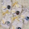 Multiple gold ribbon favor cards stacked elegantly for guests