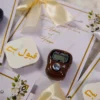 Sophisticated wedding favor presentation with gold accents