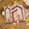 Gold cord handle detail on Mughal style wedding invitation
