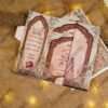 Complete traditional wedding card set with gold cord on burlap backdrop