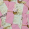 Single pink wedding card with wax seal and pampas grass close-up detail