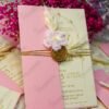 Pink wedding cards with pampas grass accents and pink baby's breath styling