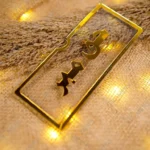 Sleek clear acrylic Haq Mehar envelope with gold calligraphy