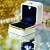Open LED ring box with built-in light on a personalized mirror ring tray
