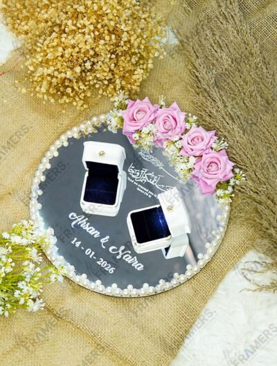 Full view of minimal pearl edition mirror engagement ring tray with white calligraphy and satin bow