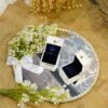 Minimalist mirror engagement ring plate with Quranic calligraphy, pearl border, and white satin bow