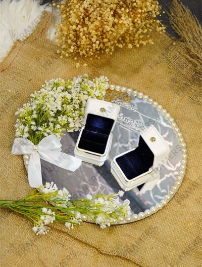 Minimalist mirror engagement ring plate with Quranic calligraphy, pearl border, and white satin bow
