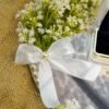 Top-down view of mirror nikkah ring tray featuring wildflowers and pearl border