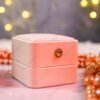 Detail of rose gold and blush pearl clustered border on square ring plate