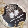 Top-down view of mirror ring tray with crystal ring holders and white floral pearl border