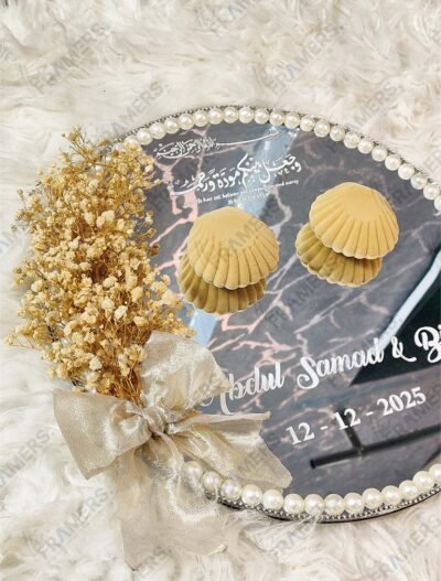 Mirror nikkah ring tray featuring velvet seashell ring boxes, golden bow, and pearl border