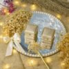 Side angle of complete marble ring tray set showing pearl border and gold pen
