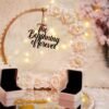 Front view of floral hoop ring tray showing blush and white rose cascade with pearl border