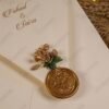 Vellum wedding card close-up showing gold text and border detail