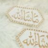 Pair of white and gold hexagonal bridal Nikkah armbands on white background