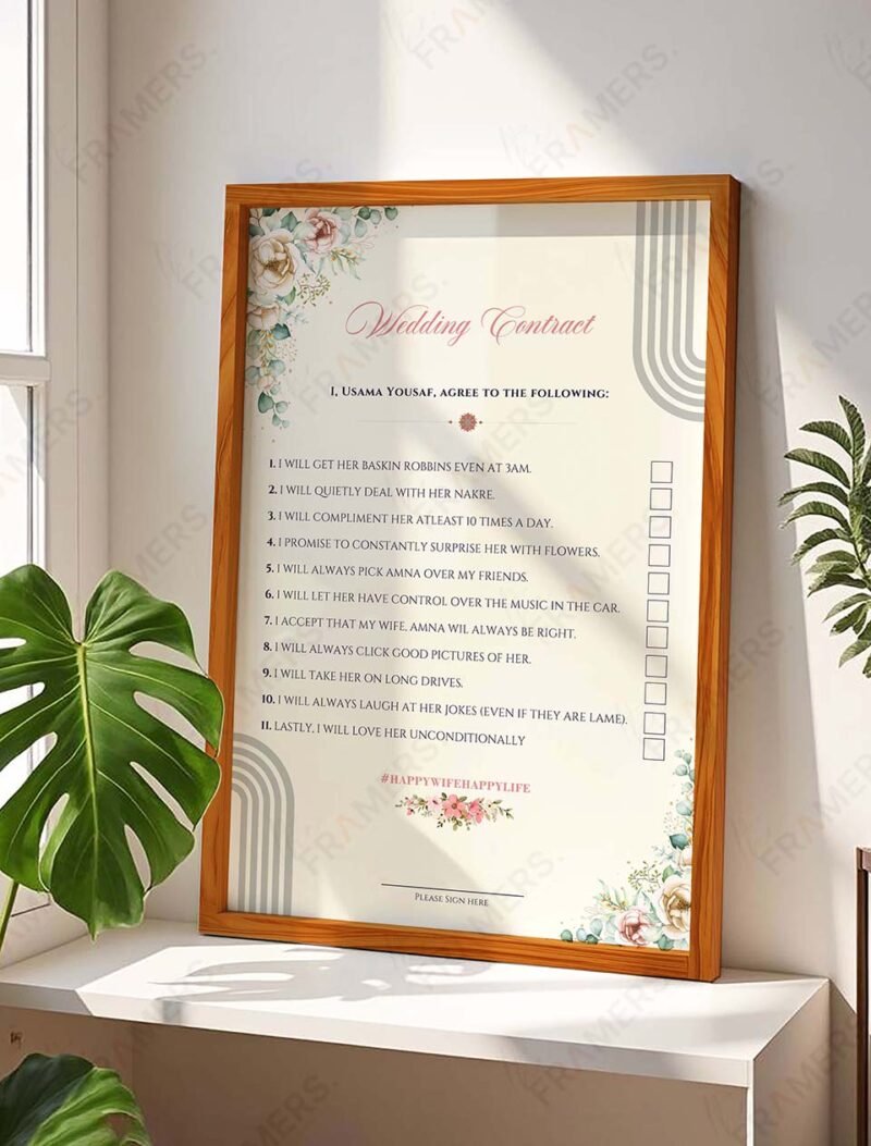Checklist style floral wedding contract in natural wood frame with tick boxes